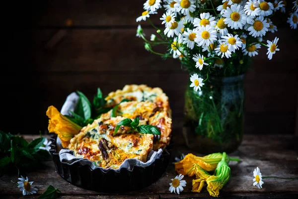 SQUASH BLOSSOM TART.style rustic.selective focus