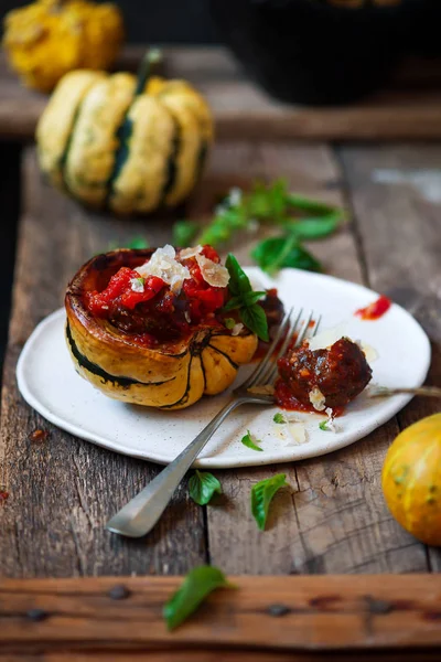 Meatball-stuffed squash with tomato  sauce. rustic style.selective focus