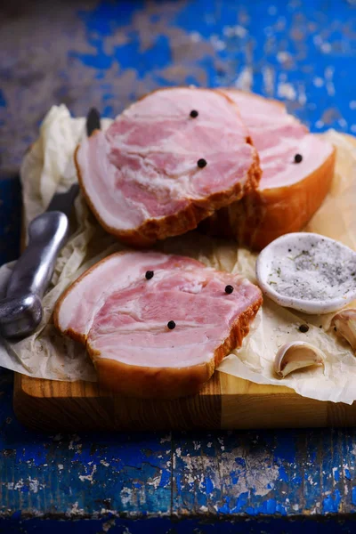 The cut  a Smoked bacon on a cutting board — Stock Photo, Image