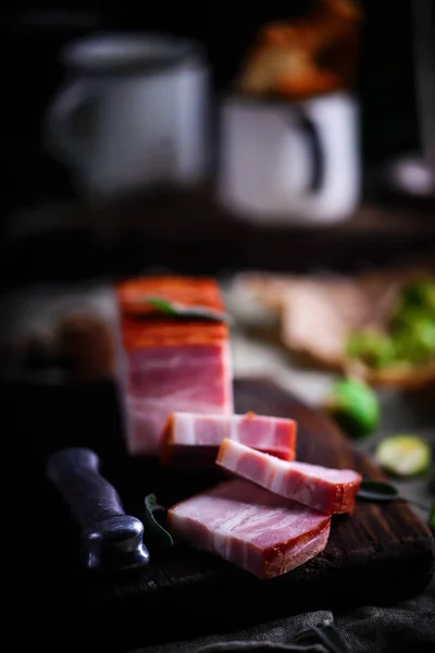 The cut  a Smoked bacon on a cutting board — Stock Photo, Image