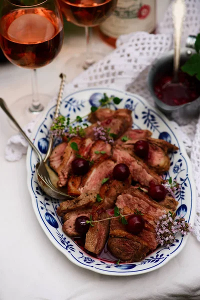 Duck Breast with Cherry Sauce.. style rustic — стоковое фото