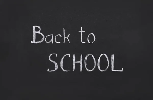 Back to school, template, handwritten in chalk, text on a black board