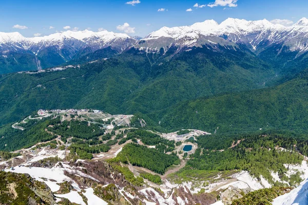 mountain valley with snow-capped mountain peaks