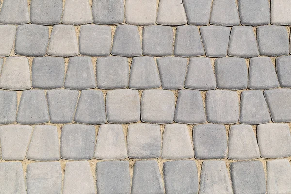 stone road. the texture of the stones. stone background. the design of the laying of cobblestones