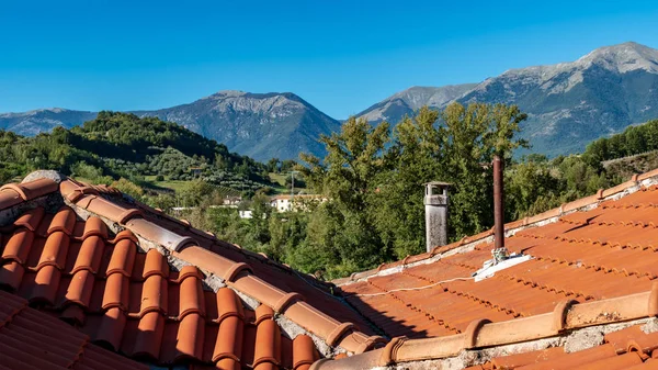 roof and chimney on mountain landscape