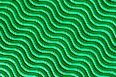 Işık ve yeşil oluklu karton gölgelerde dalgalı çizgilerle.