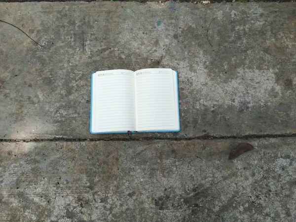 open book with a blank white paper on the table. concept of education and knowledge