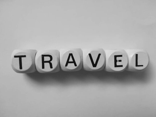 Travel word on white dice cubes