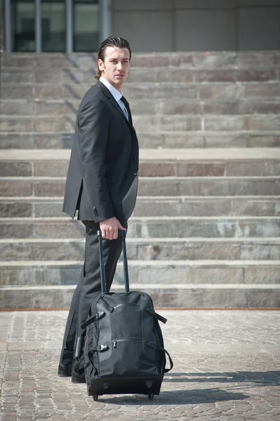 Young business man with suitcase. — Stock Photo, Image