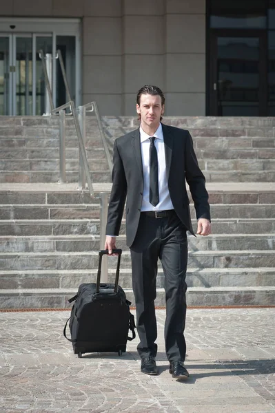 Young business man with suitcase. — Stock Photo, Image