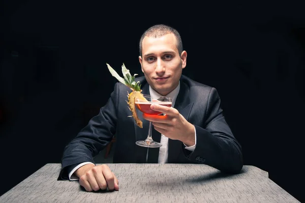 Elegant Young Man Drinking Cocktail Black Background — Foto Stock