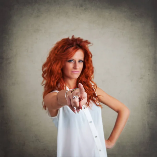 Pointing Redhead Woman Grunge Background — Stock Photo, Image