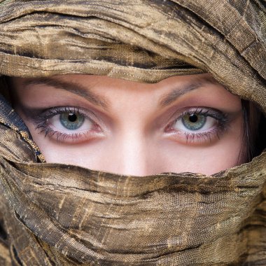 Portrait of veiled woman with beautiful eyes. 