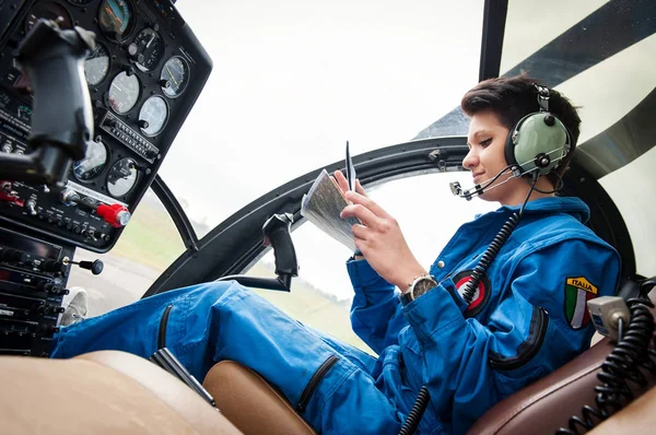 Young Woman Helicopter Pilot Reading Map — Stock Photo, Image