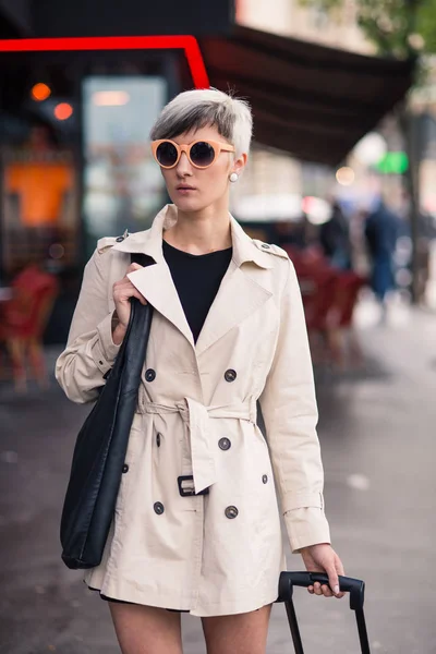 Young woman portrait walking in Paris, France.