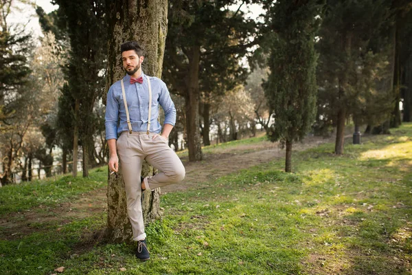 Hipster Young Man Relaxing Smoking Cigarette Outdoors Park Full Body — Stock Photo, Image