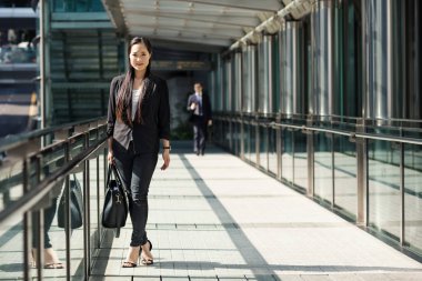 Young businesswoman portrait in Hong Kong in a sunny day.