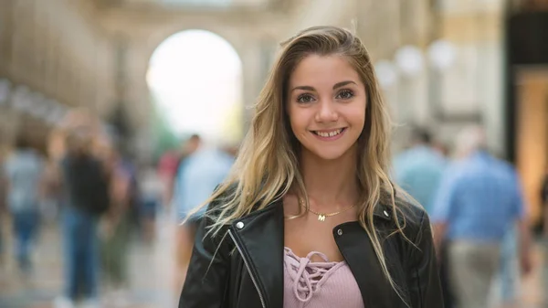 Portrait of young smiling blonde teenager girl inside Galleria V — Stock Photo, Image