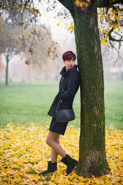 Beautiful full body portrait of young redhead woman outdoors in — Stock Photo, Image