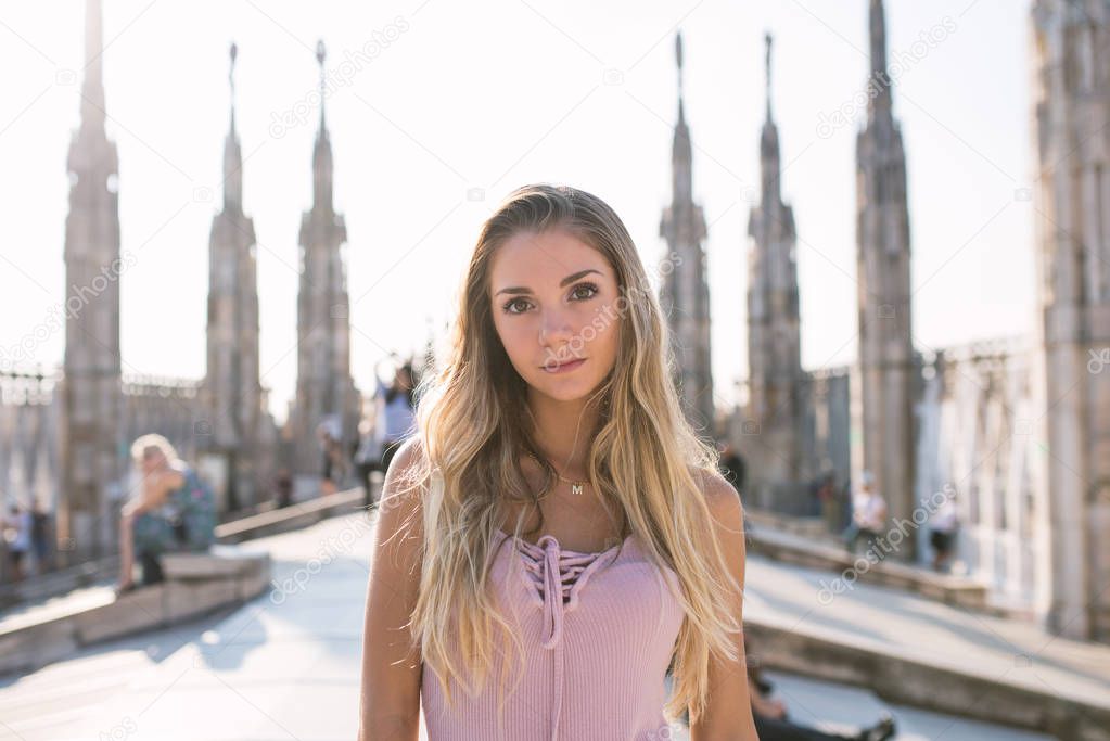 Beautiful teenager girl smiling portrait on the rooftop of the f