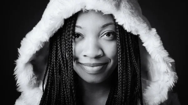 Smiling African young woman close up studio portrait with braids — Stock Photo, Image