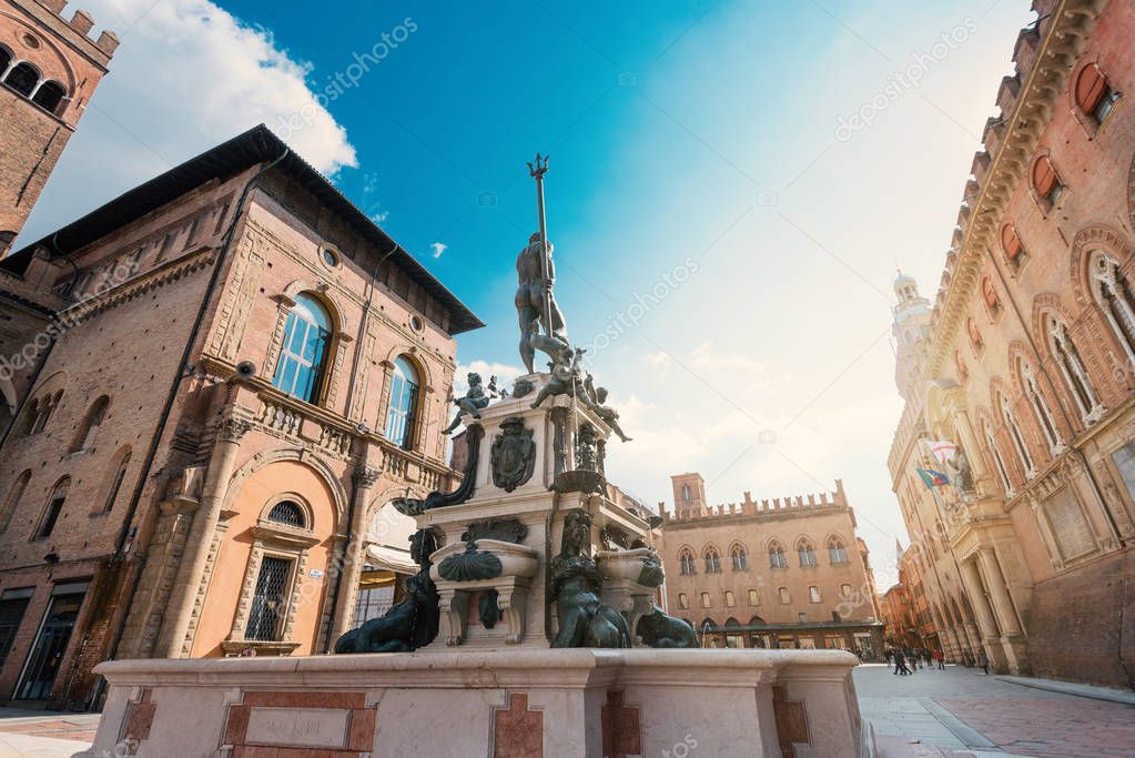 Fountain of Neptune in a sunny day with blue cloudy sky. Bologna. Italy. 