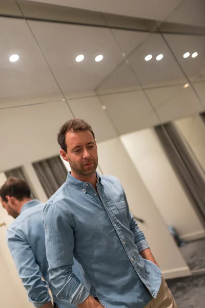 Elegant Young Man Portrait While Trying Shirt Clothing Store — Stockfoto