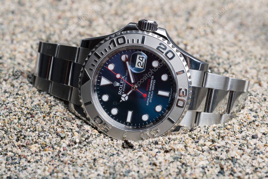 Rolex Oyster Perpetual Date Yacht Master watch on sand