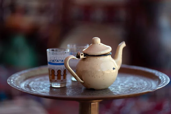Traditional tea and teapot on a tray in marrakech, Morocco.