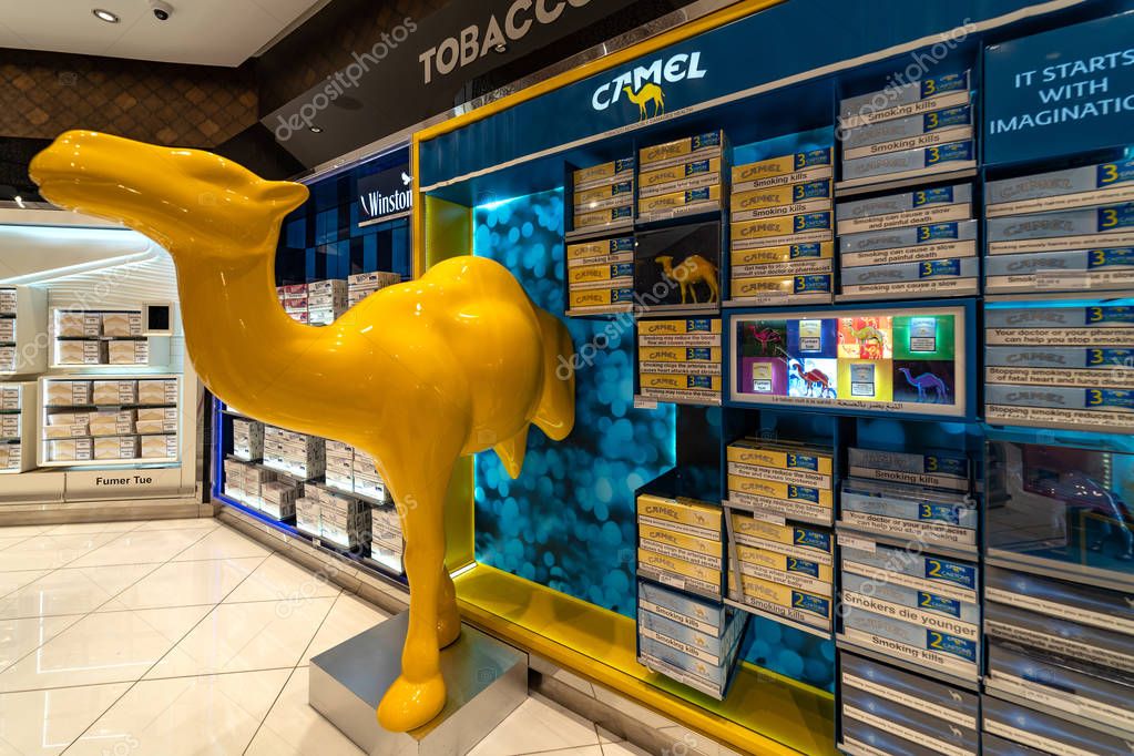 MARRAKECH, MOROCCO - APRIL 2019: Camel cigarettes inside duty free shop at the Menara airport. Camel is a brand owned by JTI - Japan Tobacco International.