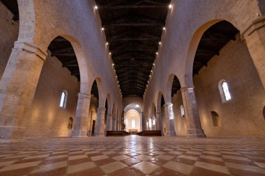 AQUILA, ITALY - DECEMBER, 2018: Santa Maria di Collemaggio basilica (XIII century) interior view. The church is a masterpiece of Abruzzese Romanesque and Gothic architecture. clipart