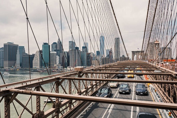 NEW YORK CITY - MAY 13, 2015: Traffic on Brooklyn Bridge with Manhattan skyline in the background.
