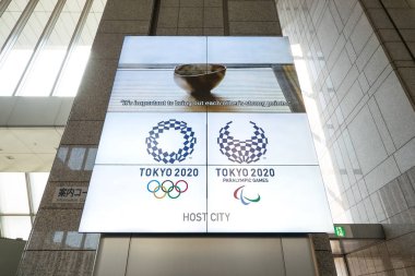 TOKYO, JAPAN - MARCH, 2017: Olympic Games Poster Tokyo 2020 shown inside the Metropolitan Government Building. clipart