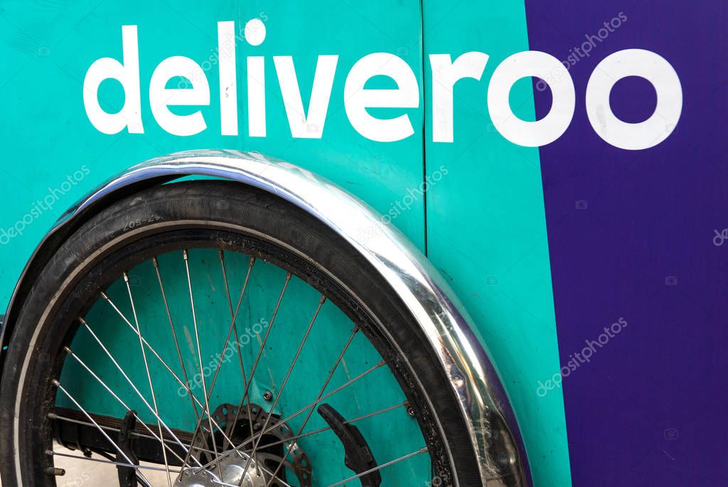 LONDON, UNITED KINGDOM - CIRCA MAY, 2018: Deliveroo delivery bike close up on logo in London. Deliveroo is a British online food delivery company with operations across the world.