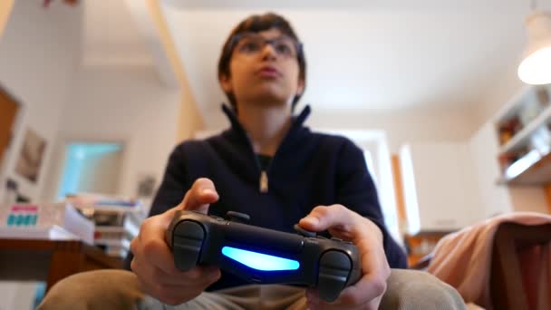 Young Kid Playing Video Games Holding Controller — Stock Video