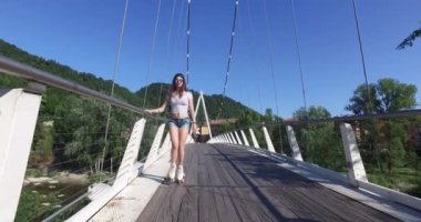 Young teenager with roller skating on a sunny day in summer.