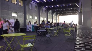 NEW YORK CITY - MAY 2015: People walking on the High Line Park in Manhattan. The High Line is a public park built on an historic freight rail line elevated above the streets in the West Side.