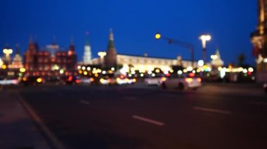 Blurred street view at night time with historical buildings in Moscow, Russia.