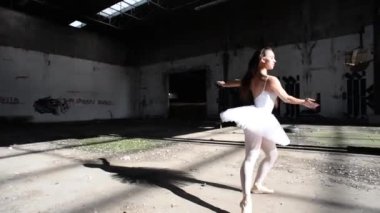 Young classical dancer in an abandoned house. Ballerina project. 