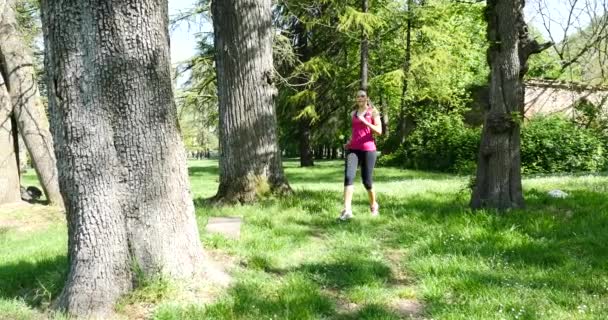 Young Beautiful Woman Running Outdoors Park — Stock Video