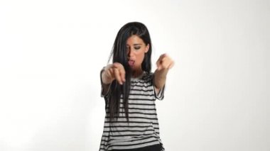 Woman wearing dancing   against white wall background. 