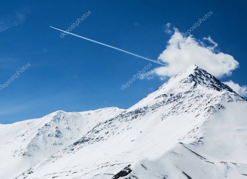 caucasian snow peak and track from plane