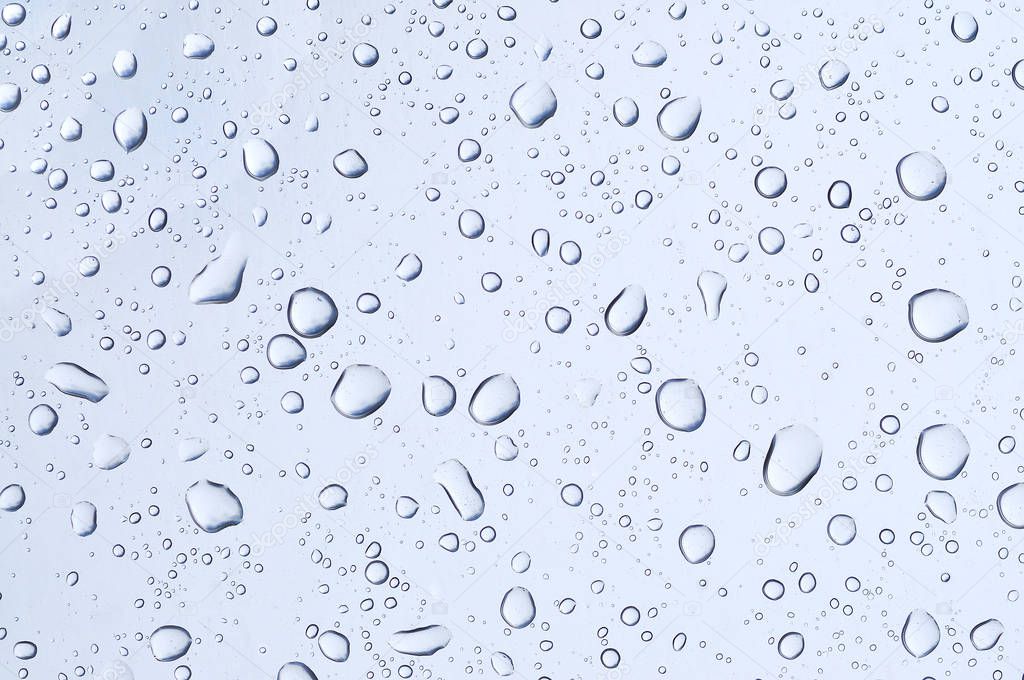 Water drops on glass mirror background.