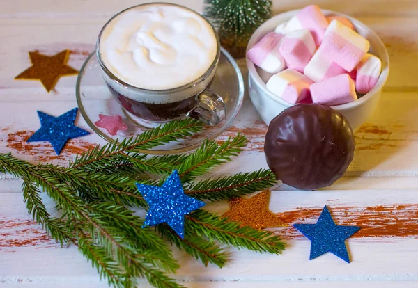 Christmas holiday atmosphere. Hot Cup of black coffee and sweet marshmallows.