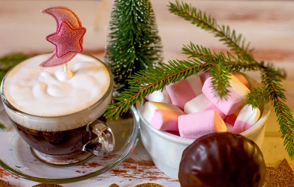 Christmas holiday atmosphere. Hot Cup of black coffee and sweet marshmallows.