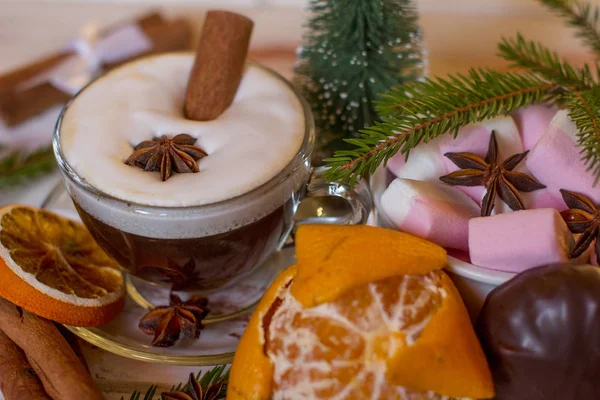 Christmas holiday atmosphere. Hot Cup of black coffee and sweet marshmallows.