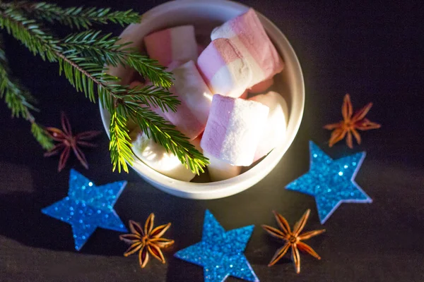 Christmas holiday atmosphere. Pink white air Christmas marshmallows.