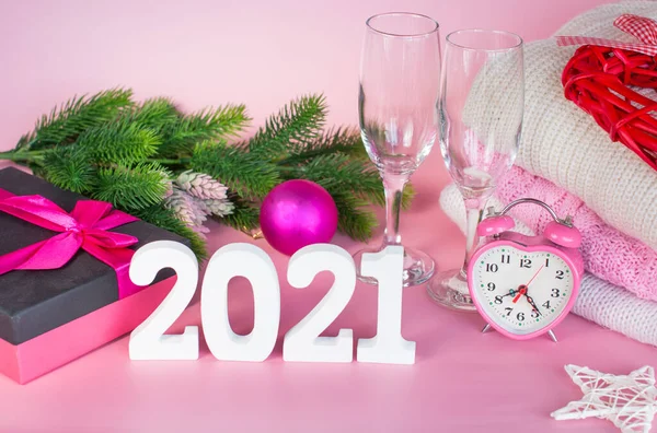 Glasses of champagne and a bottle of alcoholic beverage. New year 2021. Christmas decoration Christmas toys