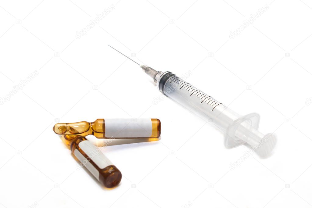 Medical 5ml syringe with 2 ampoules lying on a white background. Equipment for vaccination in medicine for laboratories and hospitals