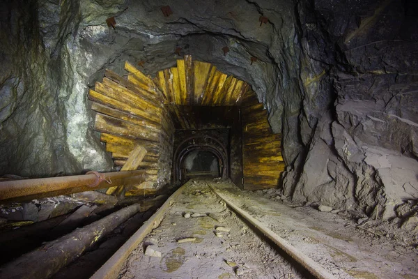 Gold mine ore shaft tunnel drift with wooden timbering underground abandoned